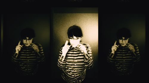 Three faded sepia copies of Meljoann, side by side. They are wearing a striped shirt, and gesticulating enigmatically.  